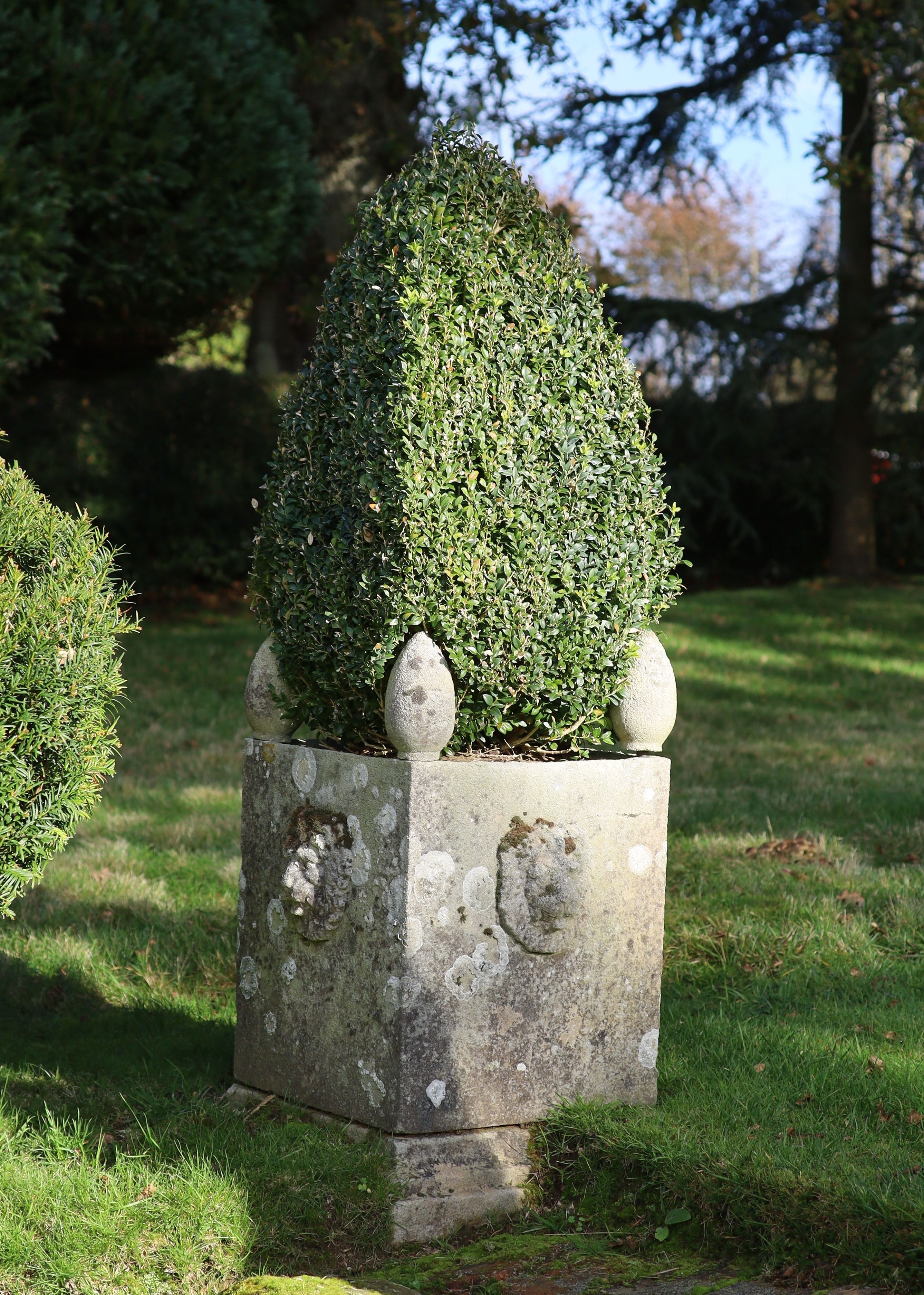 A pair of reconstituted stone garden planters, with lions mask decoration, height 74cm width 48cm